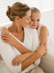 Portrait of mother and daughter hugging